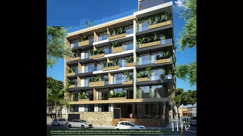 Fachada de un edificio exterior y autos estacionados en Menesse Life