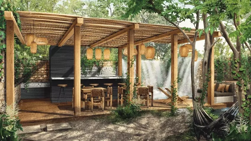 Terrasse avec bar, jardins, hamacs et canapés à Adhonai Tulum