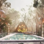 Una alberca grande con camastros en Grand Selva Tulum