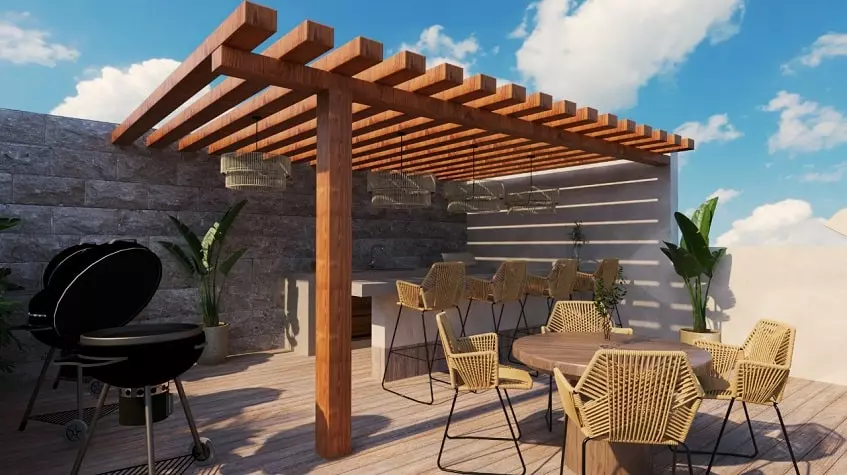 Un asador, una barra y una mesa con sillas en Monarca 28 Beach Town