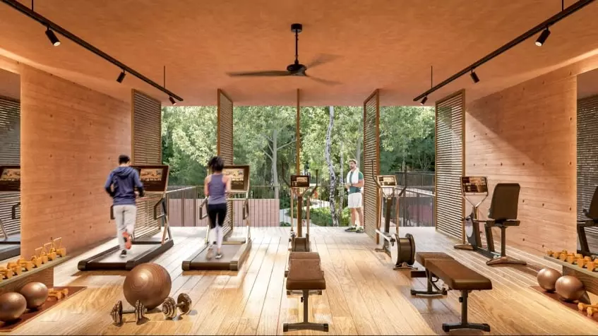 Un gimnasio con caminadoras y bicicletas spinning en Lunara Akumal