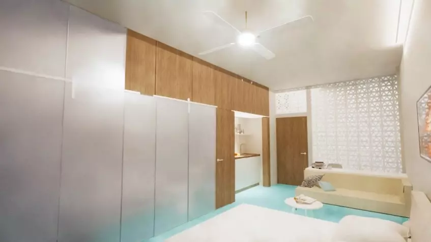 Una recamara con un sofa y una cama matrimonial en Baay