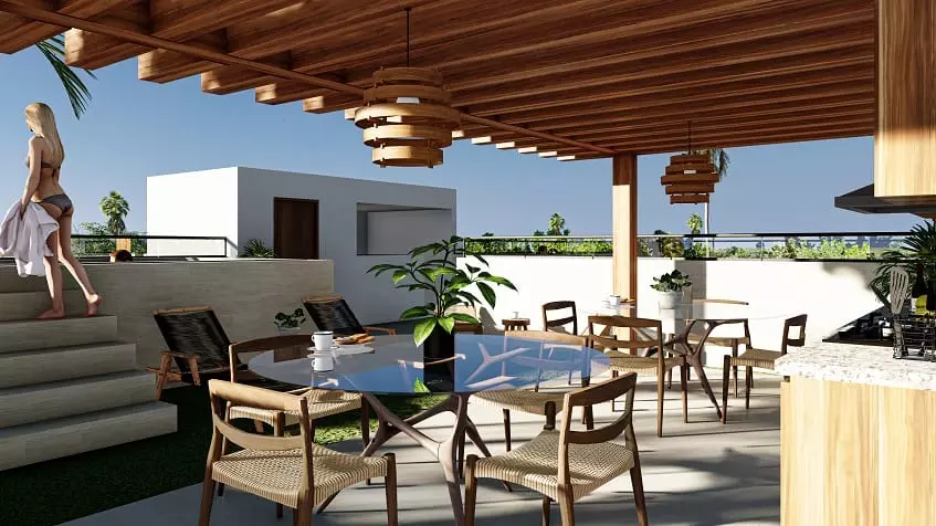 Una terraza con mesas y sillas en Zenith Tower Playa del Carmen