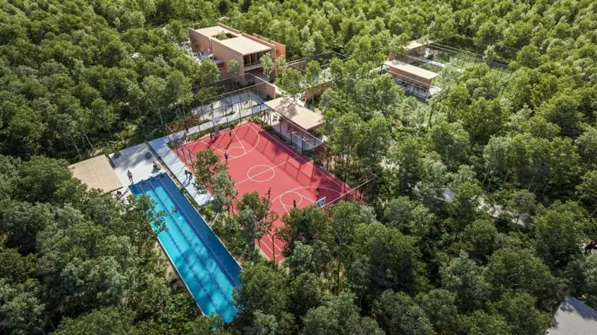 Vista aerea de una cancha de basketball y una alberca en Lunara Akumal