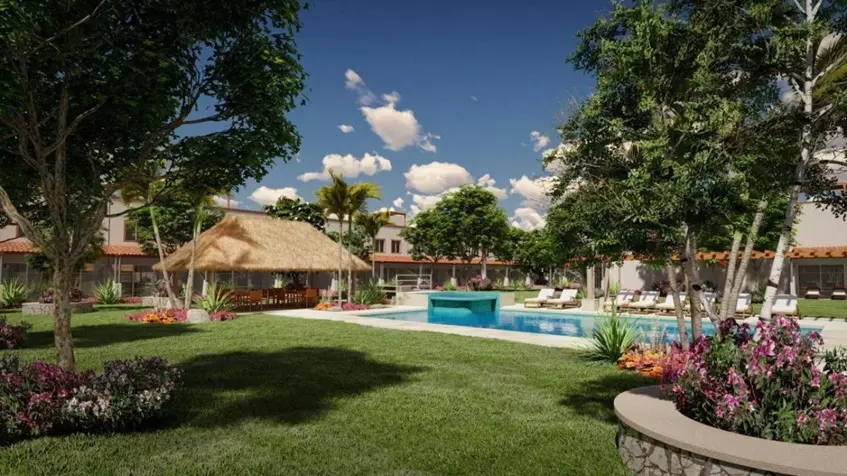 Una palapa con alberca y jardines con casas en Zendala Residencial Playa del Carmen