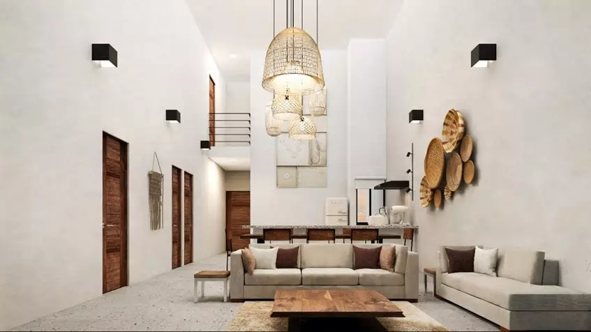 A brightly lit double-height room in Aldea Muk