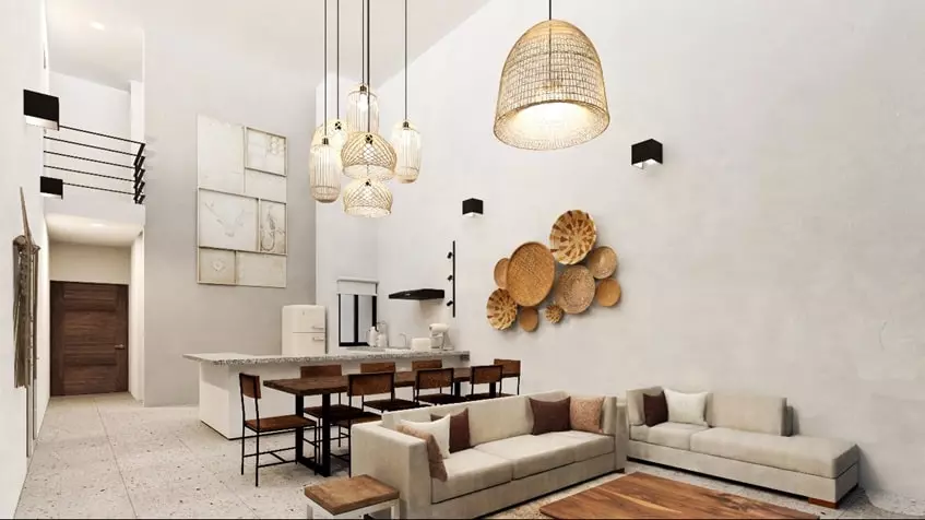 A dining room with double height in Aldea Muk