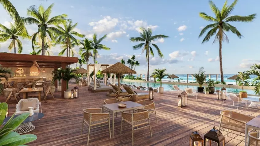 Una terraza con un restaurante en Inna Beach Condos Puerto Morelos