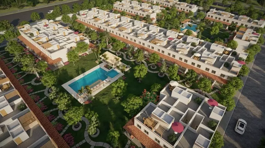 Vista aerea de varias casas con dos albercas comunes en Zendala Residencial Playa del Carmen