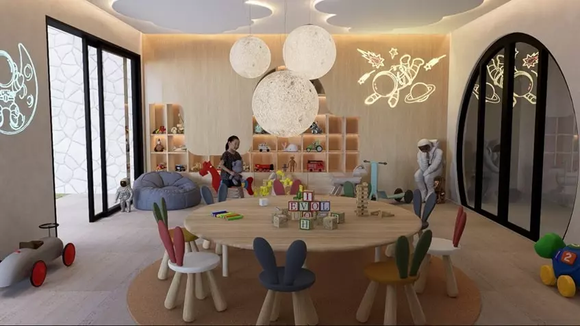 A children's playroom with a large table in the center at Okom Tulum