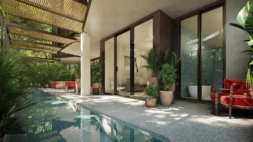 Una terraza y una alberca con un area lounge en Faena Tulum
