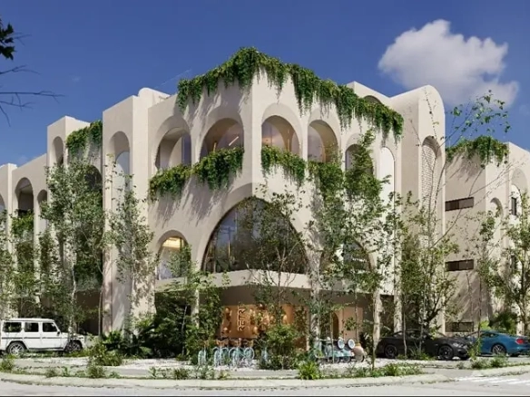 Una fachada de un edificio de departamentos en la esquina con plantas alrededor en Retrit