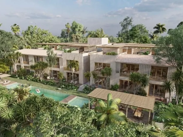 Aerial view of an apartment building and a pool at Casa Chaak