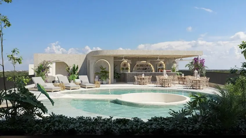 A swimming pool with lounge chairs, garden and tables in Ardeh Tulum