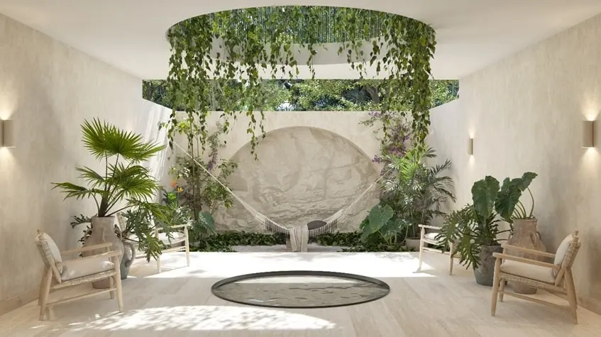 A hallway with a hammock and chairs at Ardeh Tulum