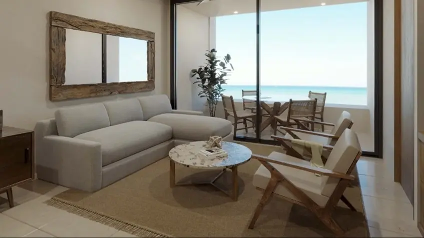 Una sala y una terraza con vista al mar en Dorada