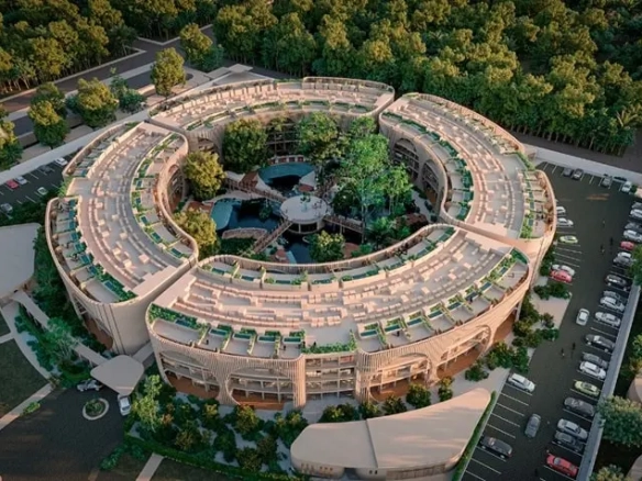 Vista aerea de un desarrollo inmobiliario en forma circular en Coko Tulum