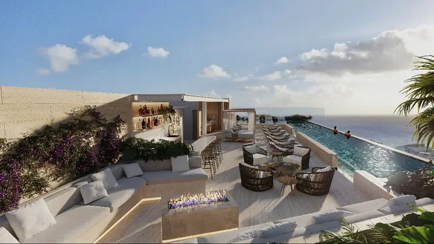 Vista aerea de un asoleadero con alberca y vista al mar en Idilik Residences Playa del Carmen