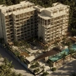 Vue aérienne de deux immeubles d'appartements et de palmiers autour d'eux à Dorada