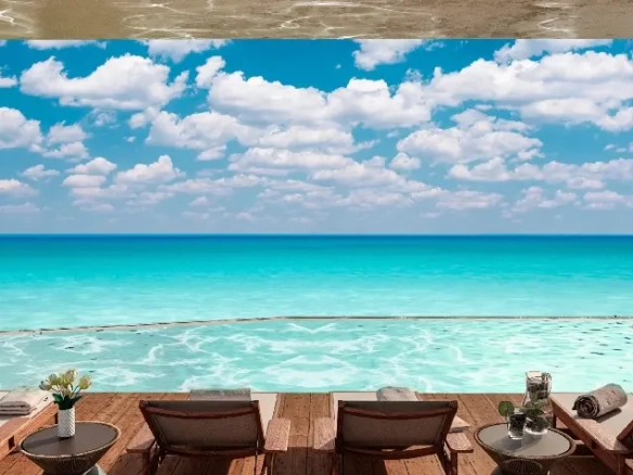 Ocean view rooftop with lounge chairs and pool at Ti-Ha Residences Tulum