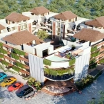 Vue aérienne d'un immeuble d'appartements et d'un parking à Naia Uhm Tulum