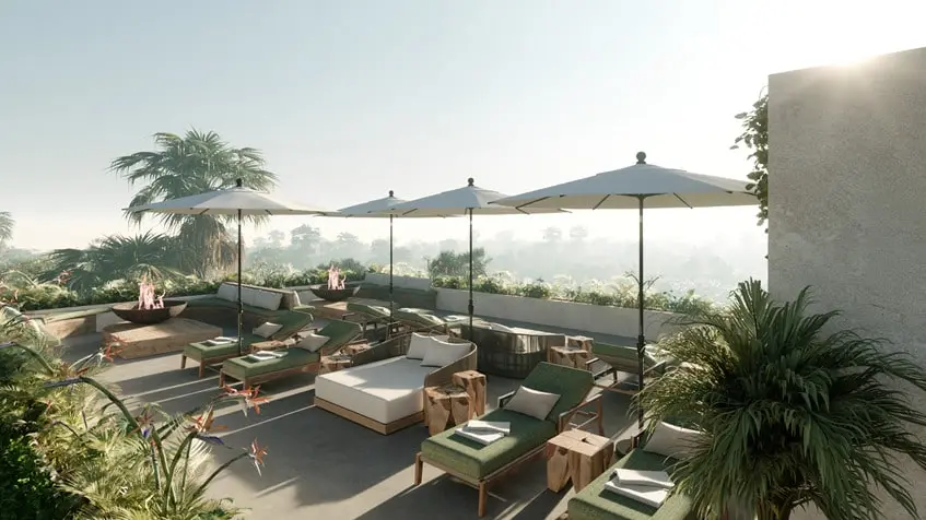 Un area de terraza con camastros y sombrillas en Entreselvas Merida
