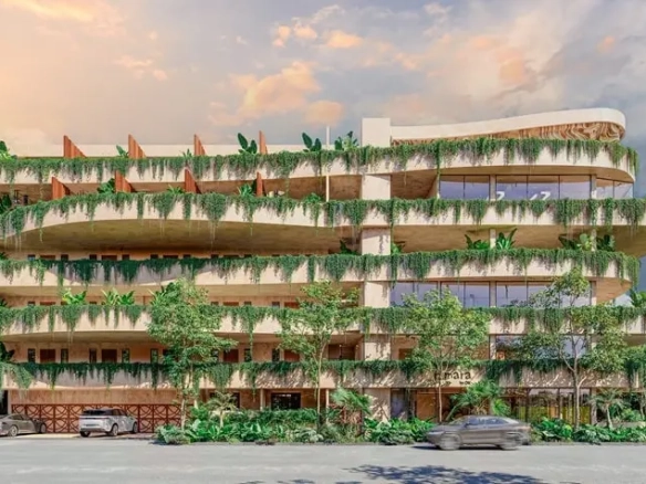 Una fachada principal de un desarrollo inmobiliario nuevo en Amara Tulum