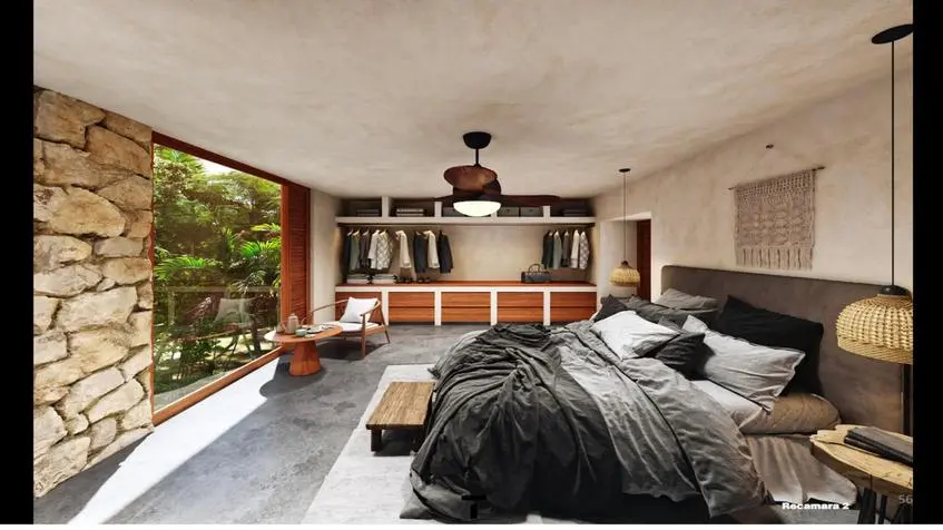 Vue de l'intérieur de la chambre à coucher de la villa Casa Bakal Tulum