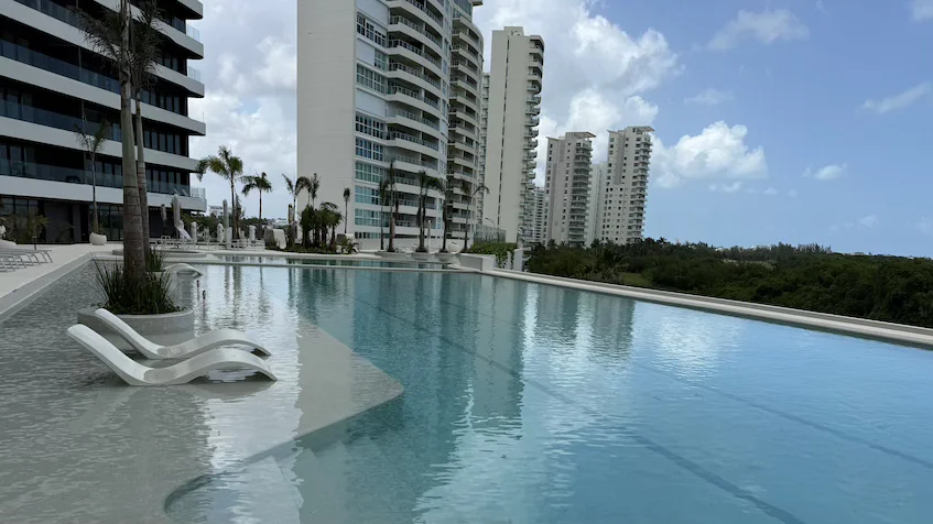 Pool with sunbeds at Woha Puerto Cancun