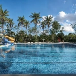 Pool with lounge chairs at Selva Real Playa del Carmen