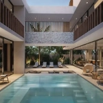 Interior con alberca camastros en Atia Essence Tulum