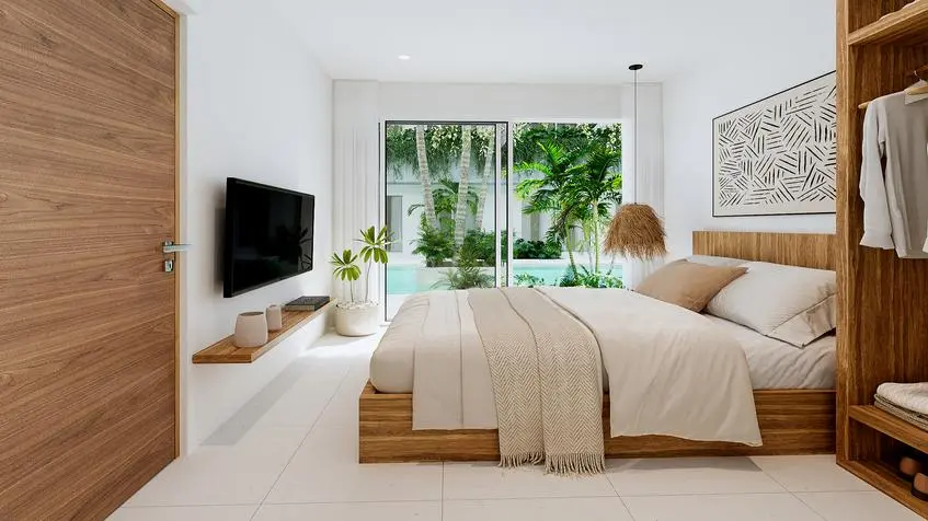 Interior de una recámara frente a la alberca en Tutuma Tulum