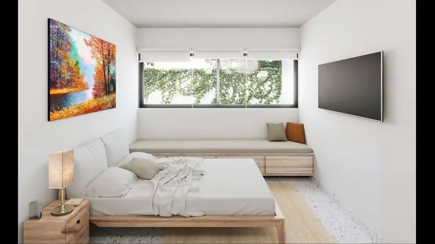 Una cama en una habitación en Casa Sevilla Playa del Carmen