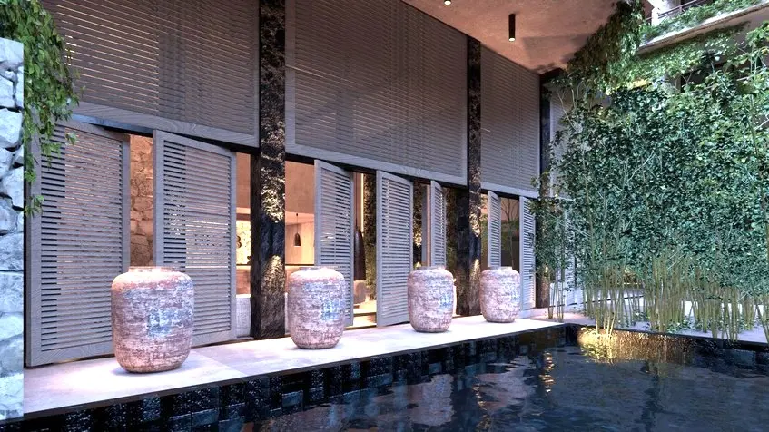 Un bâtiment avec de grands vases et une piscine à Ekab Tulum