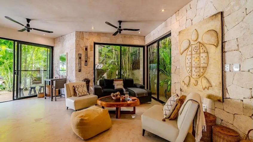 Garden view living room at Casa Caramelo Tulum