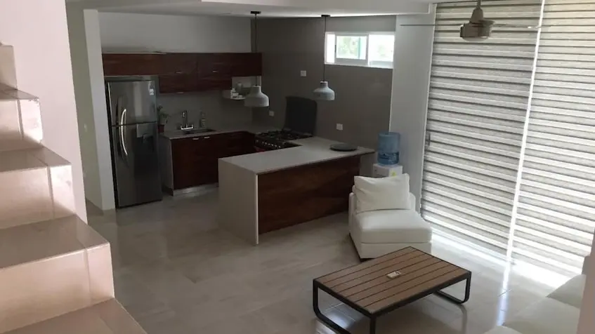 Kitchen with living room in Encuentro Residencial Playa del Carmen