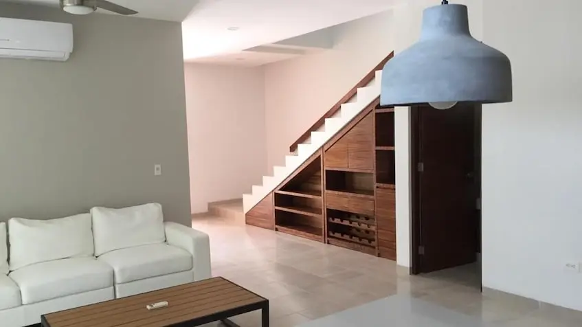 Living room with a staircase in Privada Sevilla Playa del Carmen