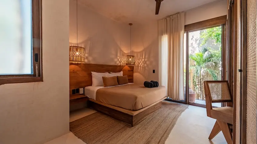 Master bedroom with access to the terrace in Kokoon Villa Tulum
