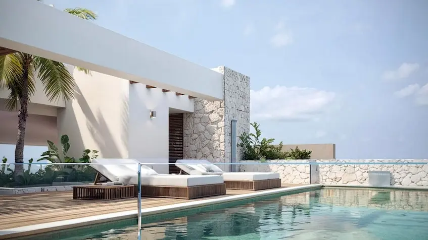 Alberca camastros en Costalina Residences Playa del Carmen