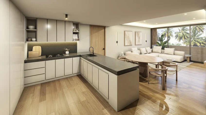 Cocina y comedor con vista a la terraza que incluye una barra de cocina integral con estufa y tarja, gabinetes superiores e inferiores, una mesa de comedor, un sofá modular y ventanales corredizos con salida al exterior de Luum Kan Cancún
