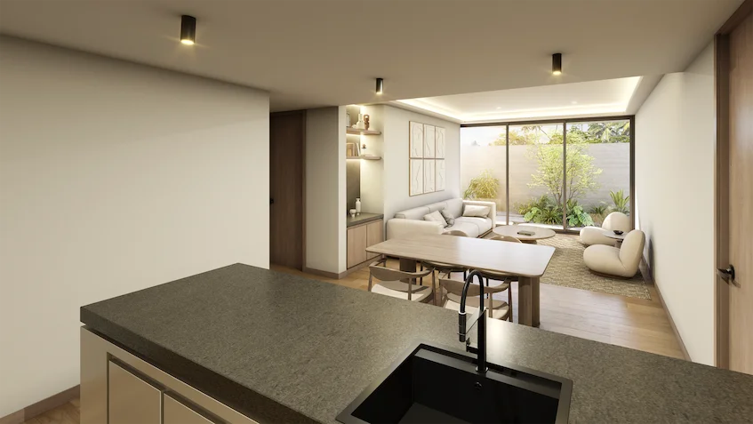 Estancia y comedor con vista al jardín que incluye una barra de cocina con tarja, una mesa de comedor, un sofá, sillones individuales y ventanales corredizos con acceso al exterior de Luum Kan Cancún
