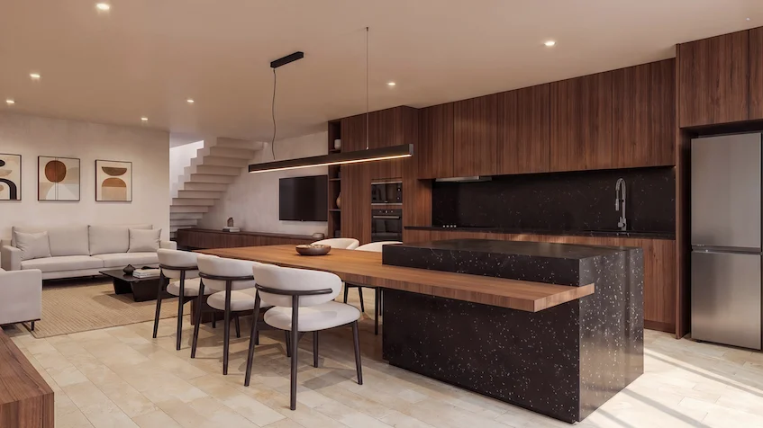 Diseño interior de sala, comedor y cocina que incluye una isla central unida a una mesa con sillas, gabinetes, un refrigerador, además de un sofá y una mesa de centro de Entre Bosques Mayakobá Playa del Carmen.