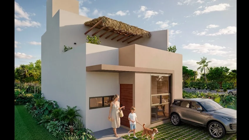 Fachada frontal de una residencia que incluye un diseño arquitectónico de dos niveles, un balcón con pérgola de madera, áreas verdes con césped de The Origin By Gran Selva Puerto Morelos