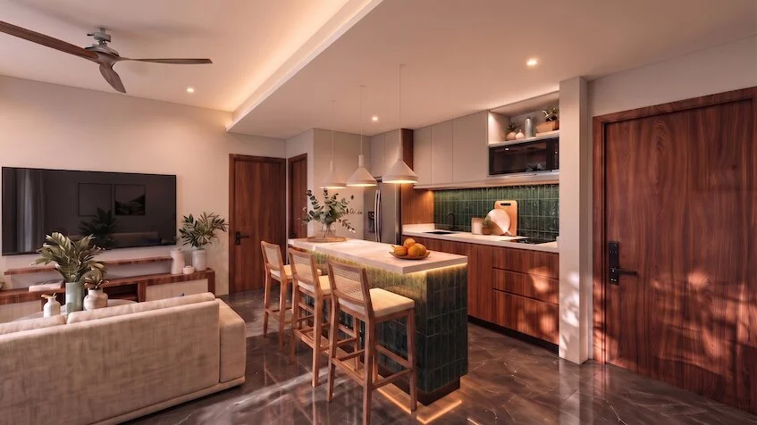 Cocina integral y barra que incluye una isla central con barra desayunadora, acabados de madera, gabinetes superiores e inferiores, y una vista hacia la sala de estar de Sensum Puerto Morelos
