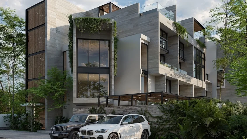 Fachada lateral que incluye un diseño arquitectónico contemporáneo de varios niveles, revestimiento de piedra, balcones con barandales de cristal, vegetación colgante y vehículos estacionados al frente de Senzik Tulum