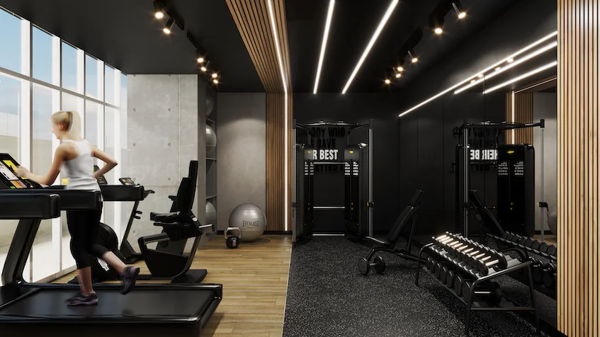 Gimnasio equipado con caminadoras frente a ventanales panorámicos, pesas libres, racks y paneles de madera de KUN 21° 86° Cancún