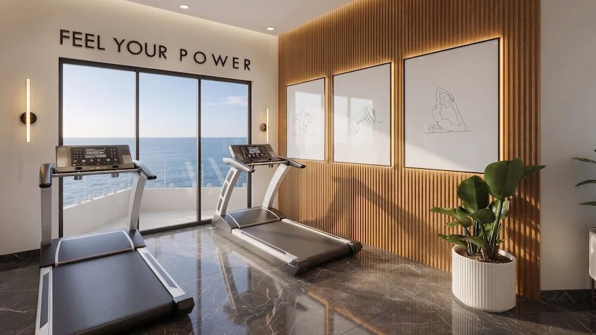 Gimnasio que incluye dos caminadoras, paneles de madera decorativos cuadros con arte lineal, un ventanal con vista al mar y un piso de mármol pulido de Sensum Puerto Morelos