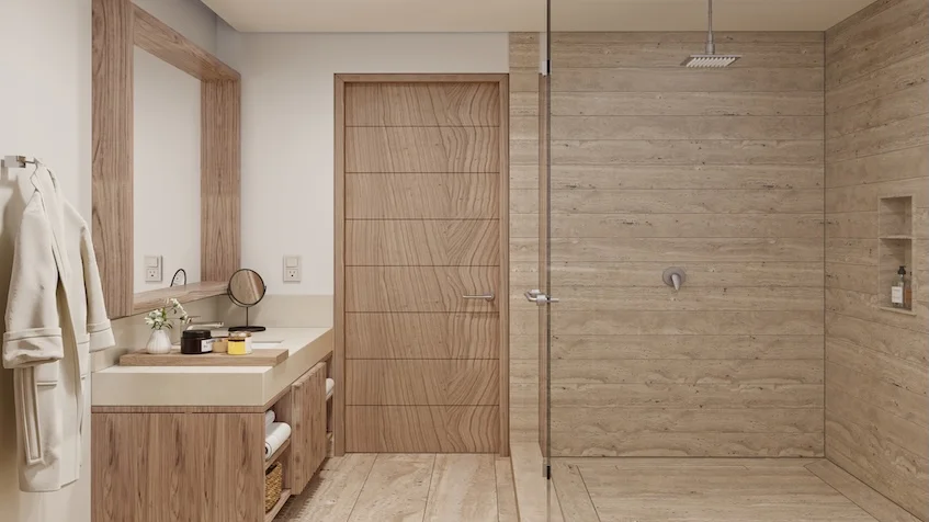 Baño moderno con mueble bajo para lavabo con repisas gran espejo de pared con marco de madera puerta al fondo y área de ducha con mampara de cristal y revestimientos en tono madera de Village Blu Puerto Morelos