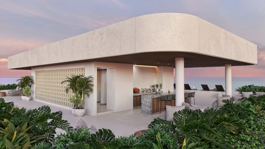 Terraza techada con bar exterior que incluye barra con bancos altos área lounge con sofás y tumbonas orientadas hacia el mar de Village Blu Puerto Morelos