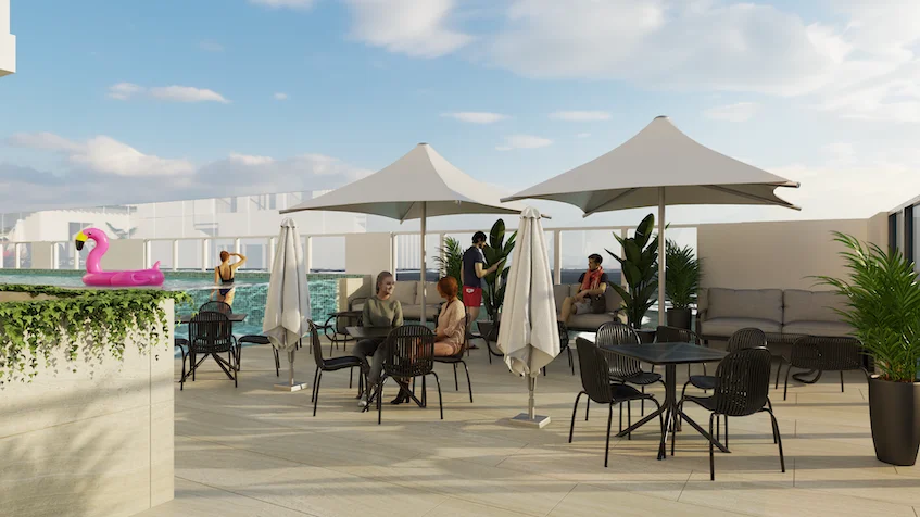 Terraza rooftop que incluye una piscina con inflable rosa, mesas y sillas con sombrillas, un área de descanso con sillones y macetas con vegetación de KUN 21° 86° Cancún